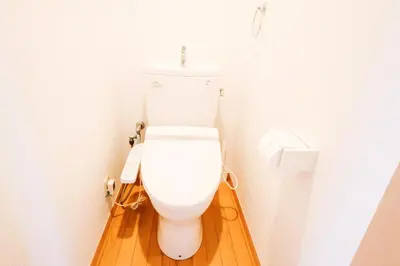 a white toilet in a bathroom with a wooden floor at takadababa 4 mins walk/新宿圈! 高速无限制网路/车站步行4分钟新装修公寓102 in Tokyo