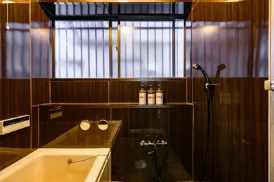 a bathroom with a shower and a tub and a window at Premier suite Nishiazabu Roppongi front in Tokyo