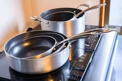 two pots and pans sitting on top of a stove at Premier suite Nishiazabu Roppongi front in Tokyo