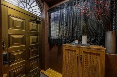 a room with a door and a window and a vase at Premier suite Nishiazabu Roppongi front in Tokyo