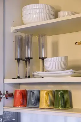 a shelf with plates and cups and bowls on it at Premier suite Nishiazabu Roppongi front in Tokyo