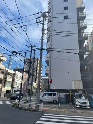 a city street with cars parked in front of a building at CAlMU ASAKUSA IMADO HOTEL ASAKUSA UENO IMADOZINZYA TOKYOSKYTREE HANEDA NARITA GINZA TOKYOSTATION Direct \u6d45\u8349\u4e0a\u91ce\u6771\u4eac\u30b9\u30ab\u30a4\u30c4\u30ea\u30fc \u6210\u7530\u7a7a\u6e2f\u7fbd\u7530\u7a7a\u6e2f\u6771\u4eac\u99c5\u76f4\u884c\u30d0\u30b9 \u96fb\u8eca\u4fbf\u5229 in Tokyo