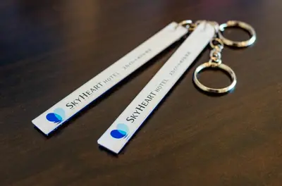 two pair of keychains sitting on top of a table at Sky Heart Hotel Koiwa - Vacation STAY 51656v in Tokyo