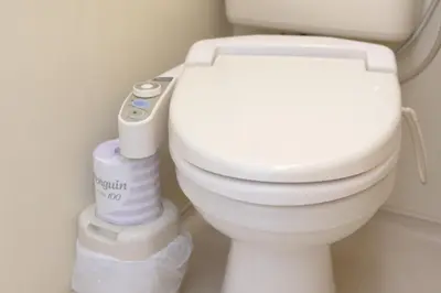 a bathroom with a toilet with a roll of toilet paper at Sky Heart Hotel Koiwa - Vacation STAY 51656v in Tokyo