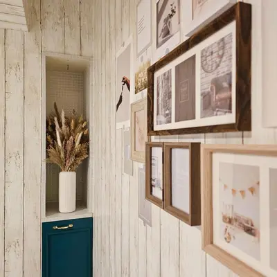 a room with pictures on the wall and a blue door at ueno minowa 502 in Tokyo