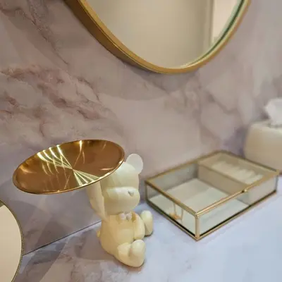 a table with a gold lamp and a mirror at ueno minowa 502 in Tokyo
