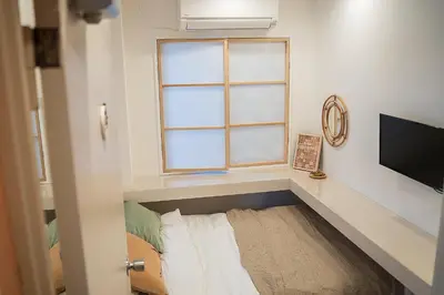 a small room with a bed and a window at Business Hotel Kankokukan - Vacation STAY 45862v in Tokyo