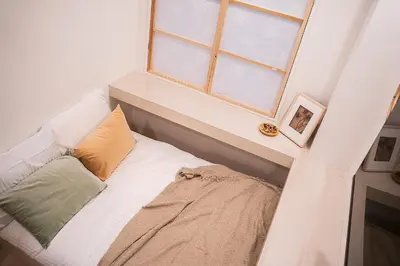 a bed in a room with a window at Business Hotel Kankokukan - Vacation STAY 45862v in Tokyo