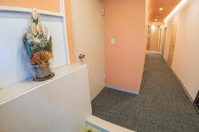 a corridor of a hallway with a hallway at Business Hotel Kankokukan - Vacation STAY 45949v in Tokyo