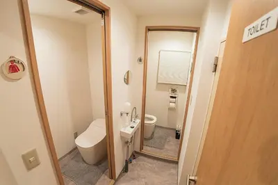 a small bathroom with a toilet and a sink at Business Hotel Kankokukan - Vacation STAY 45949v in Tokyo