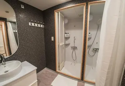 a bathroom with a shower and a sink at Business Hotel Kankokukan - Vacation STAY 45949v in Tokyo