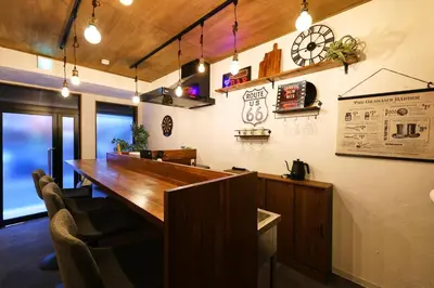 an office with a large wooden table and chairs at \u548c\u6c23\u4f1a\u3005\u90fd\u7acb\u5bb6\u653f Wakiaiai Toritsukasei in Tokyo
