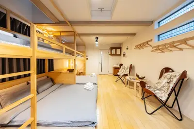 a room with bunk beds and a desk and chairs at HAN'S EBISU - Shibuya - Entire House for Max 10 ppl in Tokyo