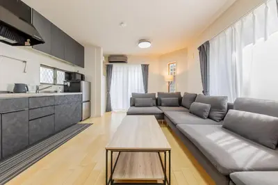 a living room with a couch and a table at HAN'S EBISU - Shibuya - Entire House for Max 10 ppl in Tokyo