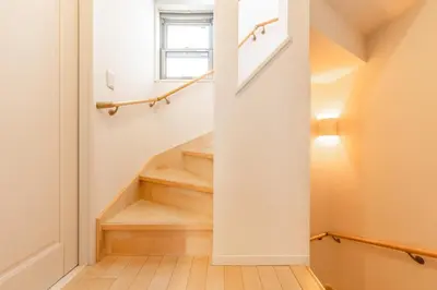 a staircase in a home with white walls and wooden floors at HAN'S EBISU - Shibuya - Entire House for Max 10 ppl in Tokyo