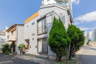 a white building with a tree in front of it at HAN'S EBISU - Shibuya - Entire House for Max 10 ppl in Tokyo