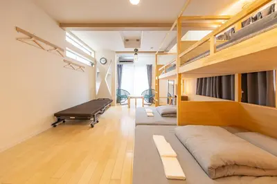a bedroom with a bed and bunk beds at HAN'S EBISU - Shibuya - Entire House for Max 10 ppl in Tokyo
