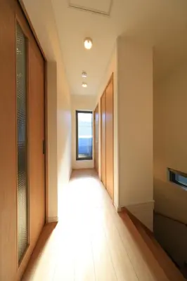 an empty hallway with a door and a window at Bliss IKEBUKURO in Tokyo