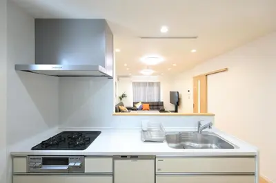a kitchen with a sink and a stove at Bliss IKEBUKURO in Tokyo