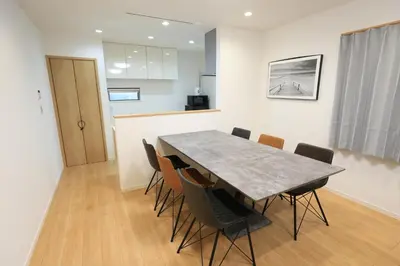 a dining room with a table and chairs at Bliss IKEBUKURO in Tokyo