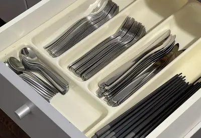 a drawer filled with silver utensils in a sink at Family Stay Tokyo Hikifune in Tokyo
