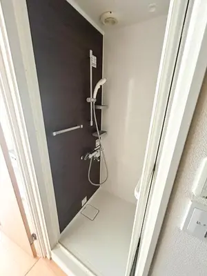 a bathroom with a shower with a black wall at JRTakadababa 2min 5LDK 5beds 2unit room in Tokyo