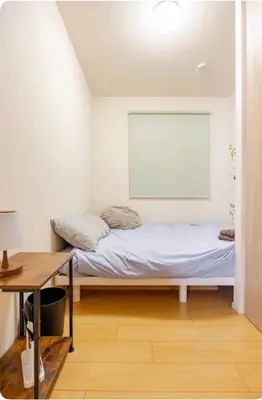 a small bedroom with a bed and a table at JRTakadababa 2min 5LDK 5beds 2unit room in Tokyo