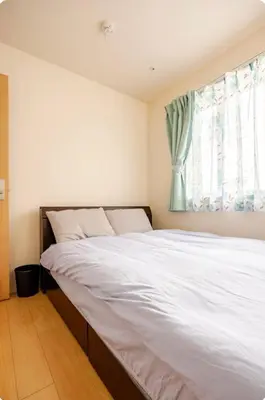 a bedroom with a large white bed with a window at JRTakadababa 2min 5LDK 5beds 2unit room in Tokyo