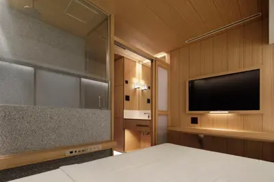 a bedroom with a bed and a flat screen tv at KOYADO HOTEL Adult only check in starts from 10pm in Tokyo