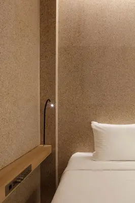 a bedroom with a bed with a lamp next to it at KOYADO HOTEL Adult only check in starts from 10pm in Tokyo