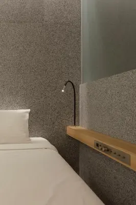 a bedroom with a bed with a lamp on it at KOYADO HOTEL Adult only check in starts from 10pm in Tokyo