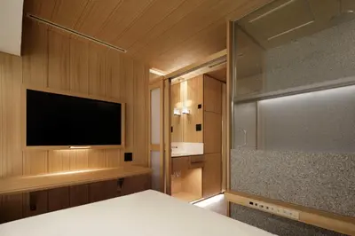 a bedroom with a flat screen tv and a bed at KOYADO HOTEL Adult only check in starts from 10pm in Tokyo