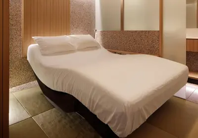 a large white bed in a small room at KOYADO HOTEL Adult only check in starts from 10pm in Tokyo