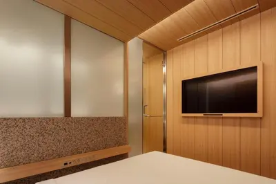 a bedroom with a flat screen tv on a wall at KOYADO HOTEL Adult only check in starts from 10pm in Tokyo