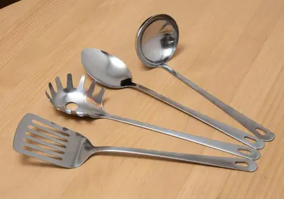 three spoons and a magnifying glass on a table at Lido Urayasu in Tokyo