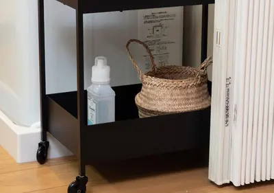 a shelf with a basket and a bottle of soap at Lido Urayasu in Tokyo