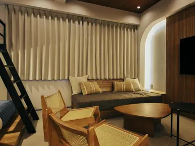 a living room with a couch and a table at illi Mani Shibuya in Tokyo