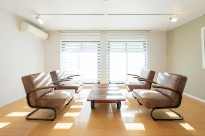 a waiting room with chairs and a table at Courtyard HIROO in Tokyo