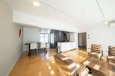 an open living room with a table and chairs at Courtyard HIROO in Tokyo