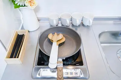 a frying pan with a spatula on top of a sink at Shinjuku Ryokan Retreat丶Local Tokyo Experience & Short Trips Hub丶walk to Shinjuku station Y05C in Tokyo