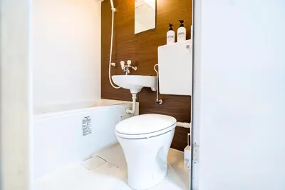 a bathroom with a toilet and a sink at Shinjuku Ryokan Retreat丶Local Tokyo Experience & Short Trips Hub丶walk to Shinjuku station Y05C in Tokyo