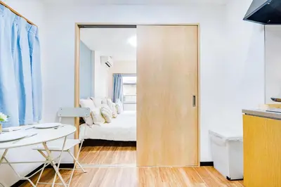 a room with a door leading to a bedroom at Shinjuku Ryokan Retreat丶Local Tokyo Experience & Short Trips Hub丶walk to Shinjuku station Y05C in Tokyo