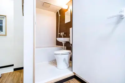 a bathroom with a toilet and a sink at Shinjuku Ryokan Retreat丶Local Tokyo Experience & Short Trips Hub丶walk to Shinjuku station Y05C in Tokyo