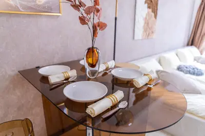 a glass table in a living room with a couch at G57\u65b0\u5bbf\u6700\u4e2d\u5fc3 \u6771\u65b0\u5bbf\u7ad95\u5206-Shinjuku center 5 mins to Station, Max 4 \u76f4\u8fbe\u65b0\u5bbf \u6d89\u8c37 \u8868\u53c2\u9053 \u6c60\u888b \u4e0a\u91ce \u4ee3\u4ee3\u6728 \u94f6\u5ea7 \u539f\u5bbf in Tokyo