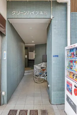 a building with a bike parked in a hallway at Shinjuku 10min Top FL Apartment -3min to Sta -Max6ppl 3bd in Tokyo