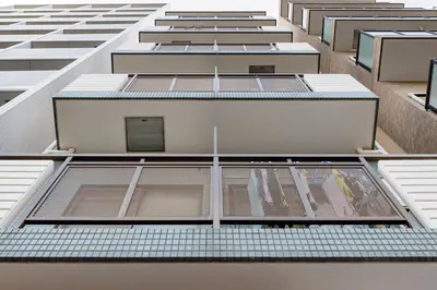 an overhead view of a tall building with windows at Shinjuku 10min Top FL Apartment -3min to Sta -Max6ppl 3bd in Tokyo
