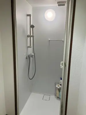 a bathroom with a shower with a shower head at Shinjuku 10min Top FL Apartment -3min to Sta -Max6ppl 3bd in Tokyo