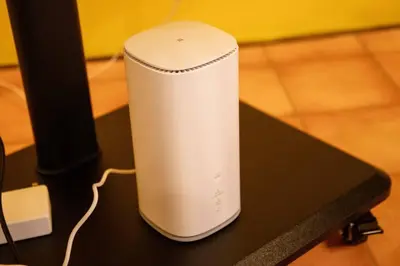 a white router sitting on top of a table at Cozy Home YOTSUGI tokyo down town in Tokyo