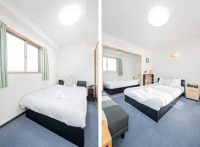 a hotel room with two beds and a room with two windows at Fukuei Stay Tokyo in Tokyo