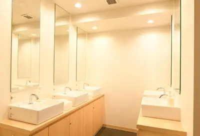 a bathroom with three sinks and two mirrors at A16 HOSTEL TOKYO in Tokyo